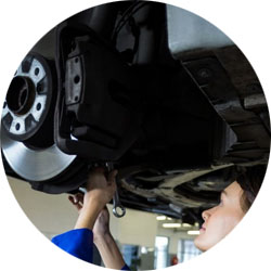 Supreme Auto Repair Mechanic fixing brakes